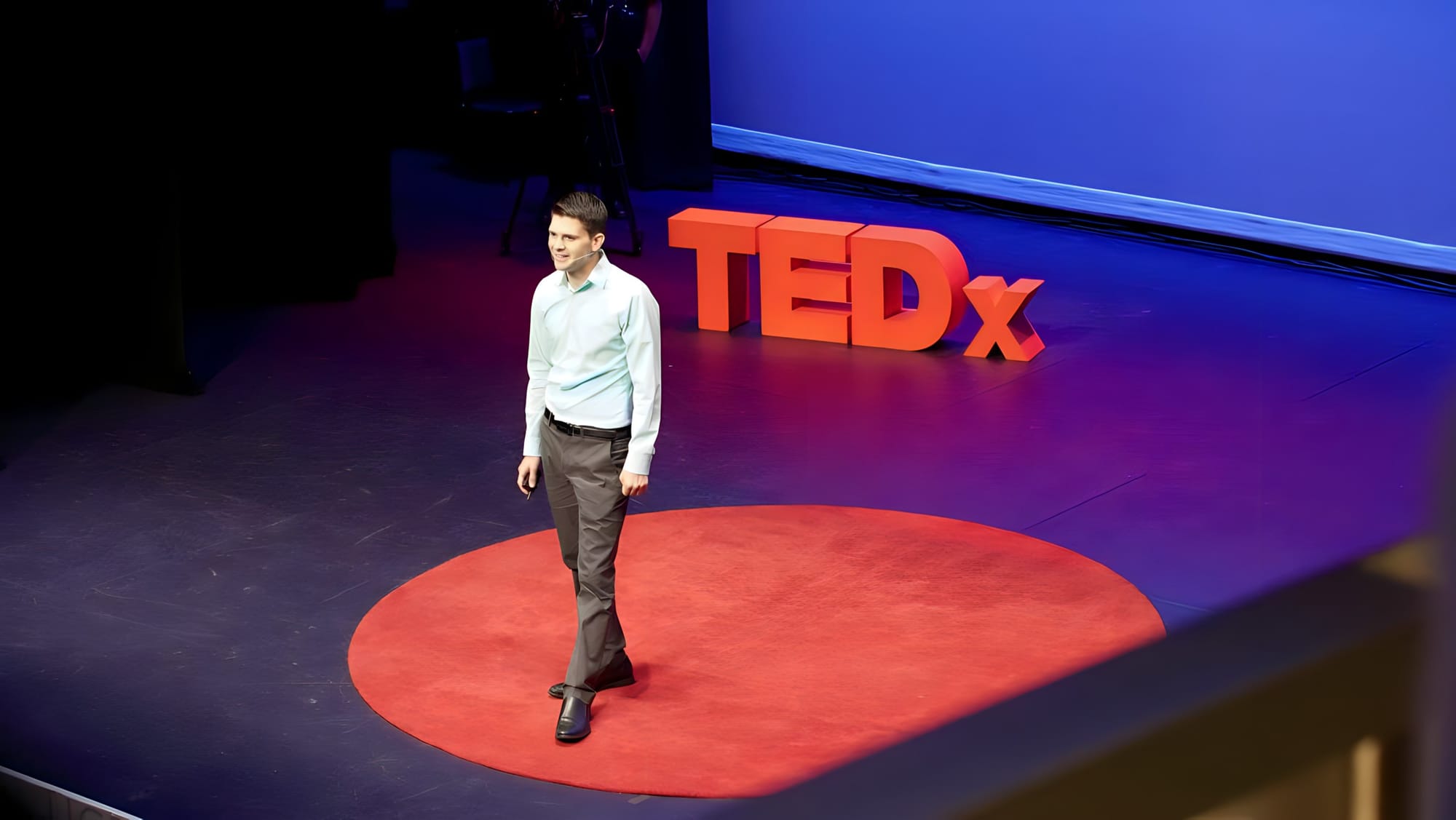 A zoomed out photo of Limbitless Solutions founder Dr Albert Manero speaking at TEDxOrlando 2017. 