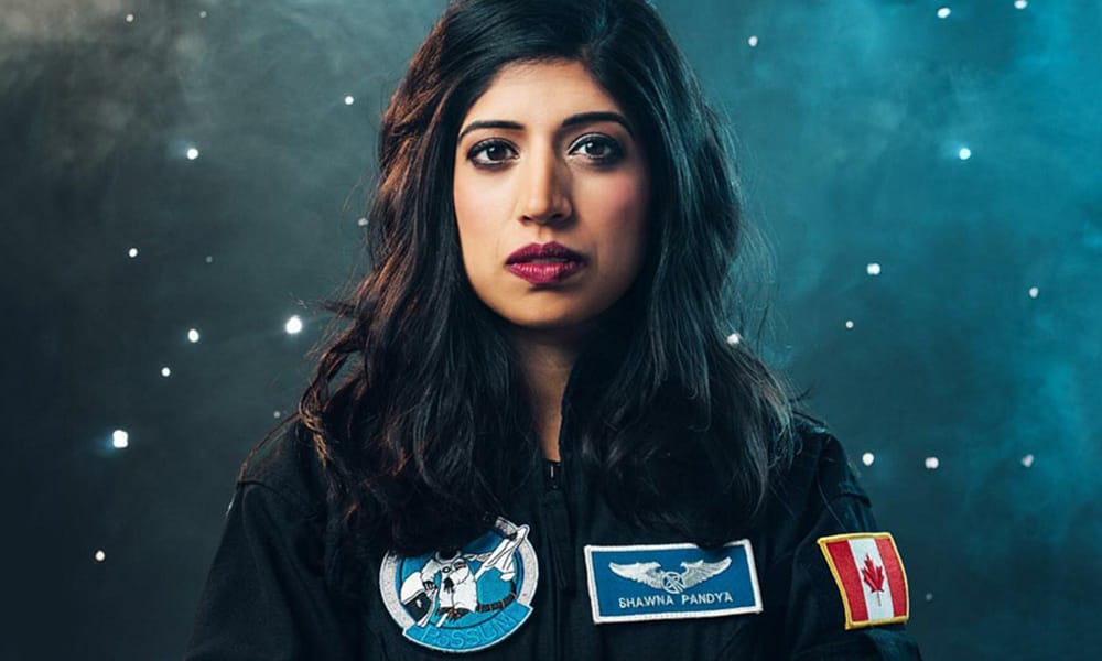 A portrait photo of Dr. Shawna Pandya wearing her astronaut suit. 