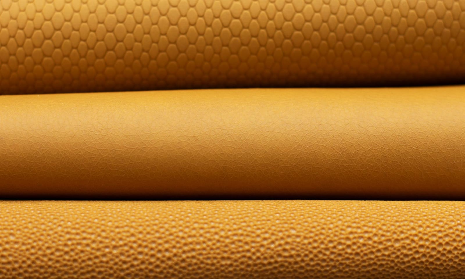 A close-up photo of TômTex's yellow orange biodegradable leather.