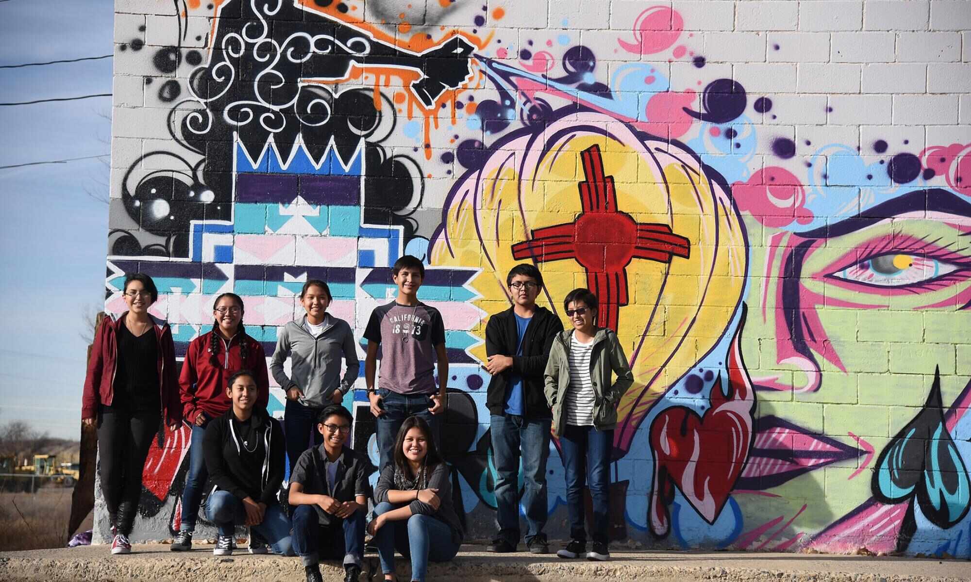 A group photo of indigenous youths posing for the camera.